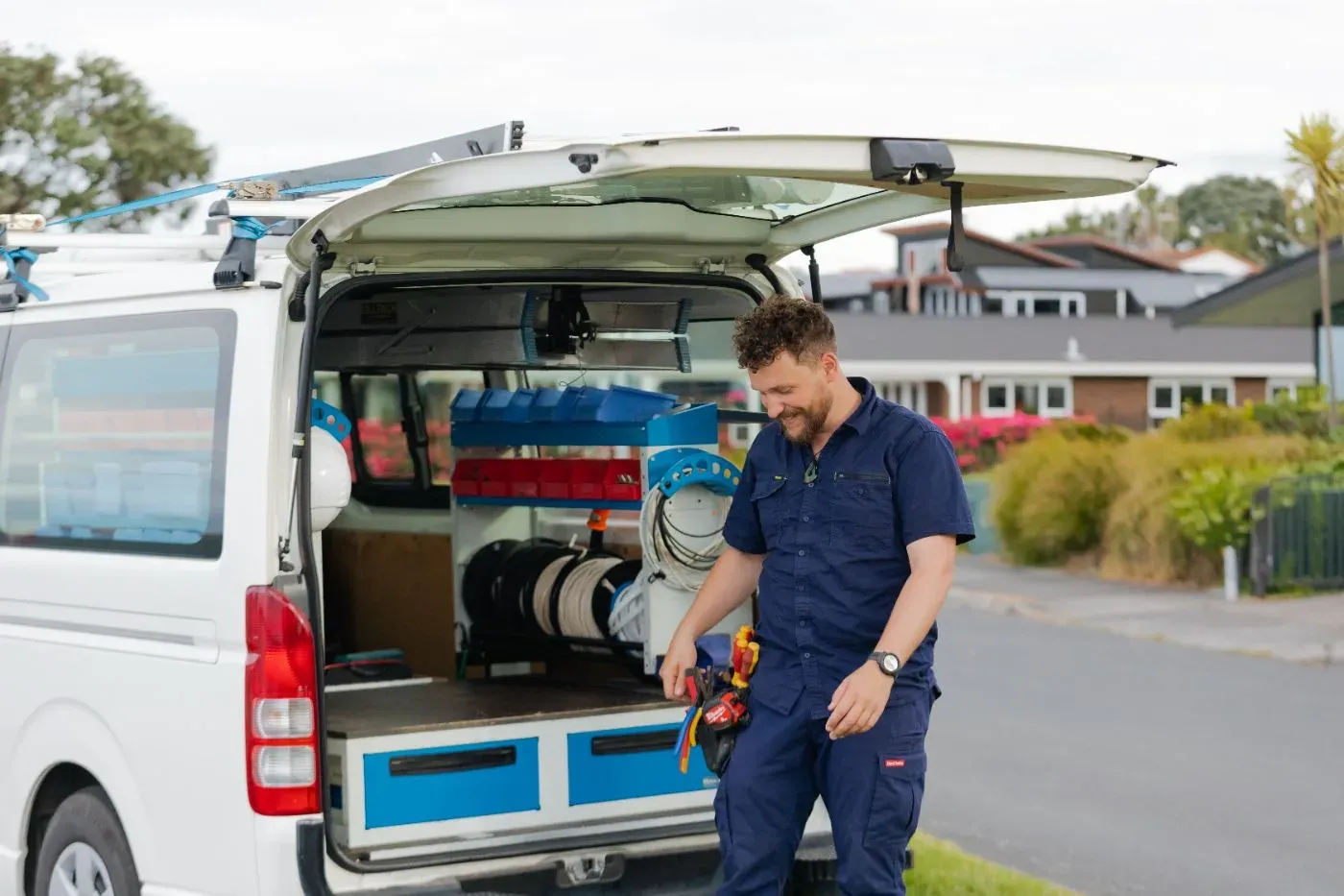 James Mace at the back of a Good Conduct van with his tools